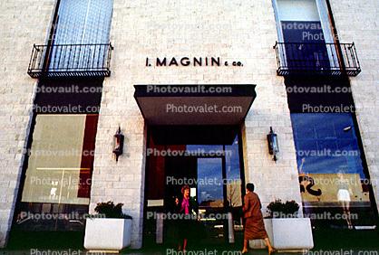 Women at an I. Magnin & Co., signage, door, entrance, 1980s
