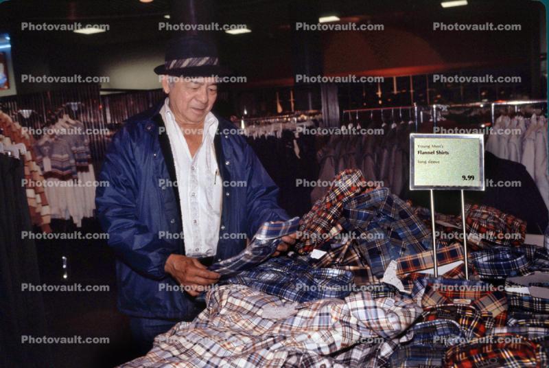 Man Shopping, interior, inside, indoors, shopper, clothing store, racks, 1980s