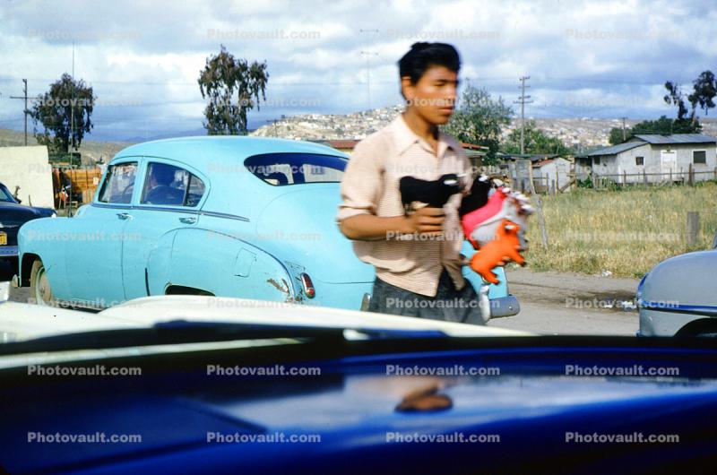 Mexican Side of The Border Crossing to the USA, Vendor Selling Toro Toys, Car, 1950s