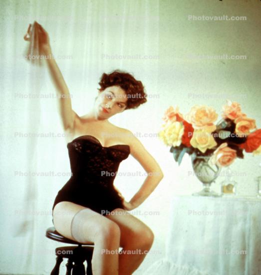 Lady holds up Sheer Stockings, 1950s