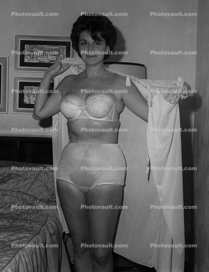 Woman putting on a night gown, fcp panties, nylon briefs, bra, nightgown, 1950s