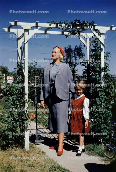 Woman, Daughter, backyard, coat, dress, 1950s