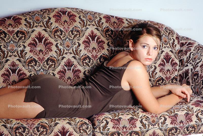 Woman on a couch, short tight dress