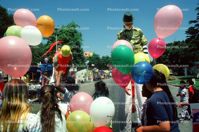 Man on Stilts and Balloons