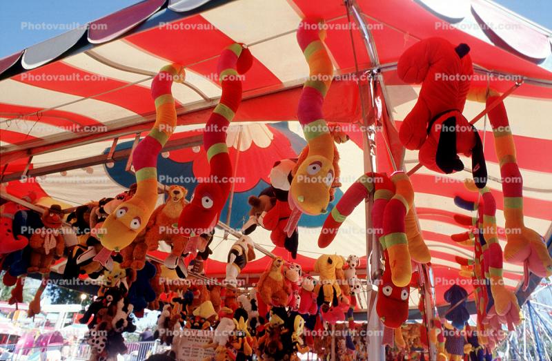 Stuffed Animals hangint from a tent