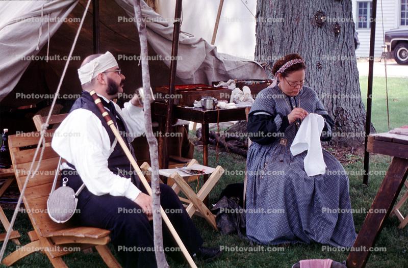 wounded soldier, woman knitting, tent, Civil War re-enactment