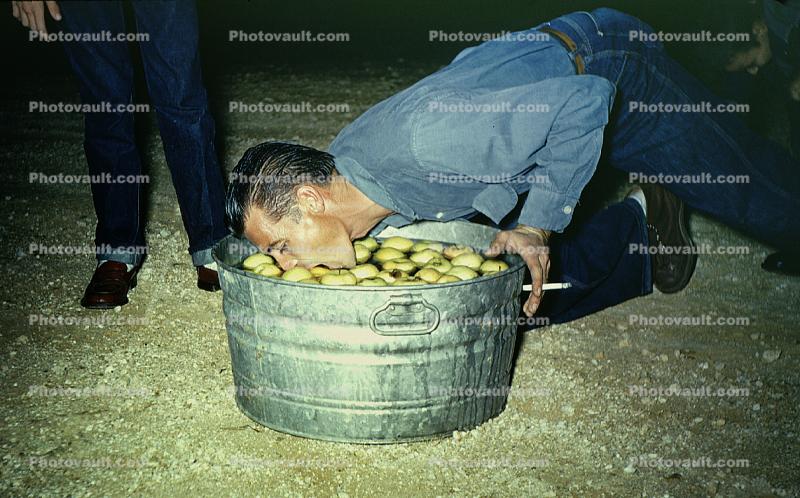 bobbing for apples, Man, Male, Cigarette, Bucket, Pail, 1940s