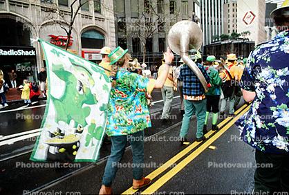 Tuba, clover leaf flag, Leprechaun, yellow line, marching band, Saint Patrick's Parade, down Market Street