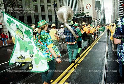 Tuba, clover leaf flags, yellow line, marching band, Saint Patrick's Parade, down Market Street