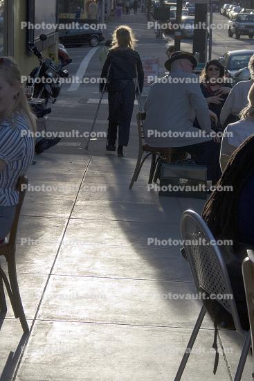 legless woman walking on crutches, North-Beach