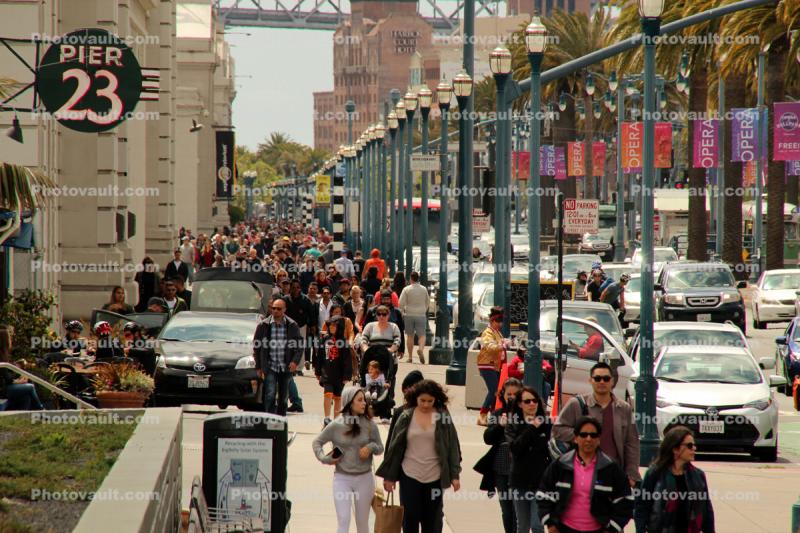 people, crowds, walking along the Embarcadero, sidewalk, buildings, piers