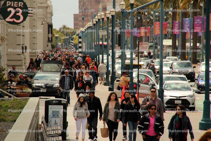 people, crowds, walking along the Embarcadero, sidewalk, buildings, piers