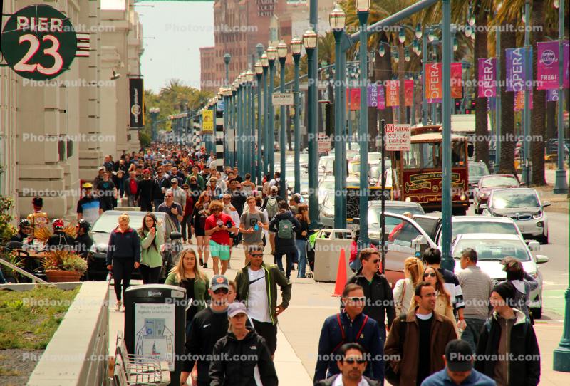 people, crowds, walking along the Embarcadero, sidewalk, buildings