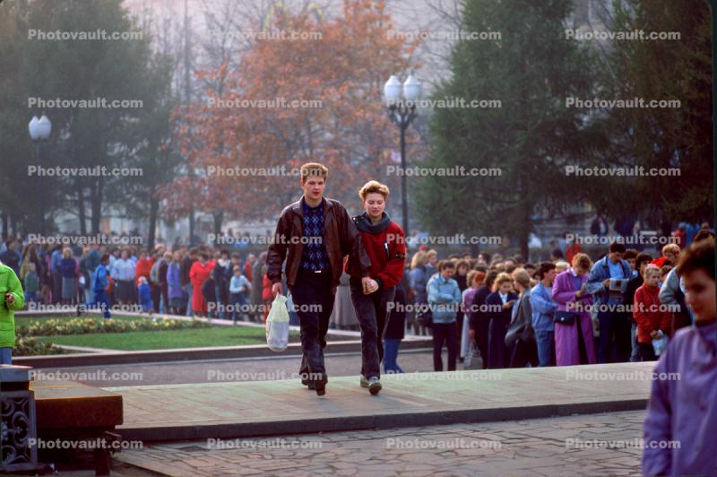 A Young Couple Walking Home, People waiting in line for McDonalds Burger, 1991