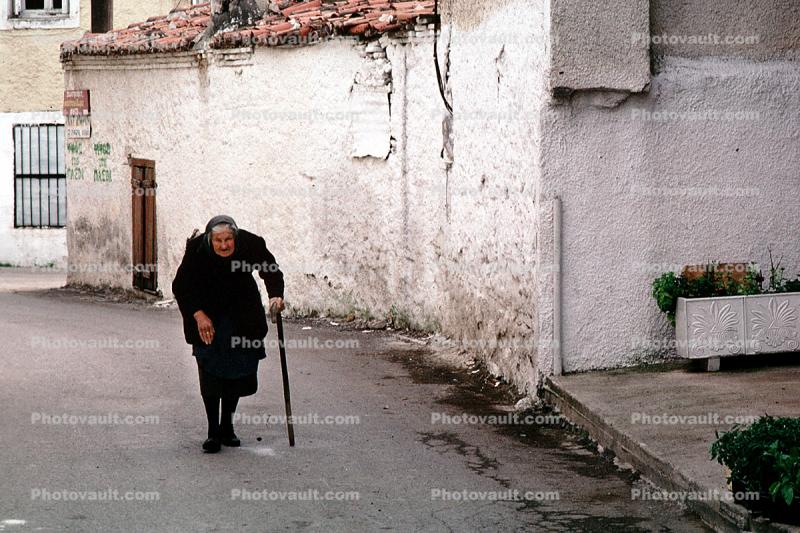 Woman Walking with Cane, Politika, Greece