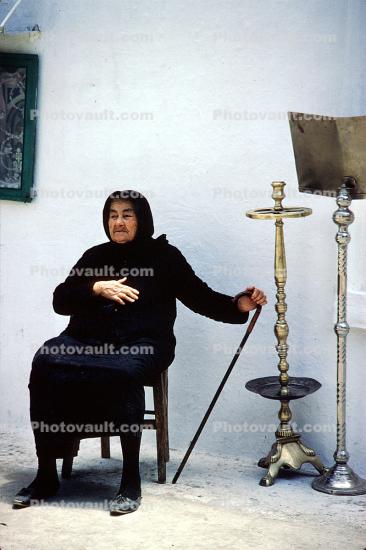 Woman sitting in a chair, huka pipe, Crete, May 1970