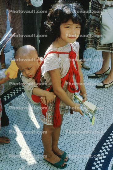 Girl, Baby, Carrying Child, September 1962, 1960s