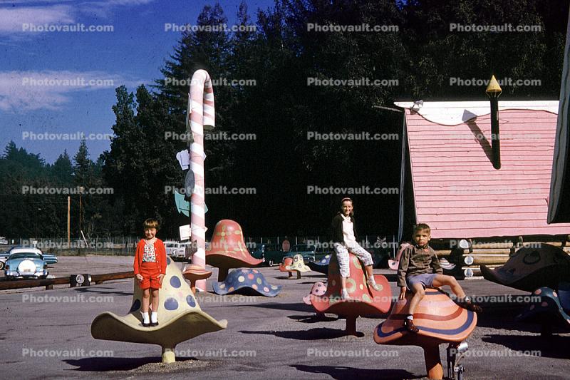Mushrooms, candaycane, cars, Santas Village, California, 1960s