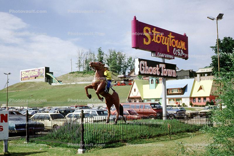 Bucking horse, statue, Storytown, buildings, hill, fence, cars, Ghost Town, Lake George, New York, 1981, 1980s