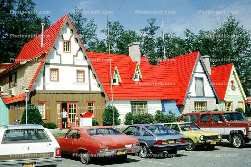 unique building, parked cars, red rooftops, Animal Land, Storytown, cars, automobiles, vehicles, 1981, 1980s