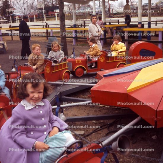 Girl, Firetrucks, Ride, Fun, Purple Coat, smiles, laughing, 1960s