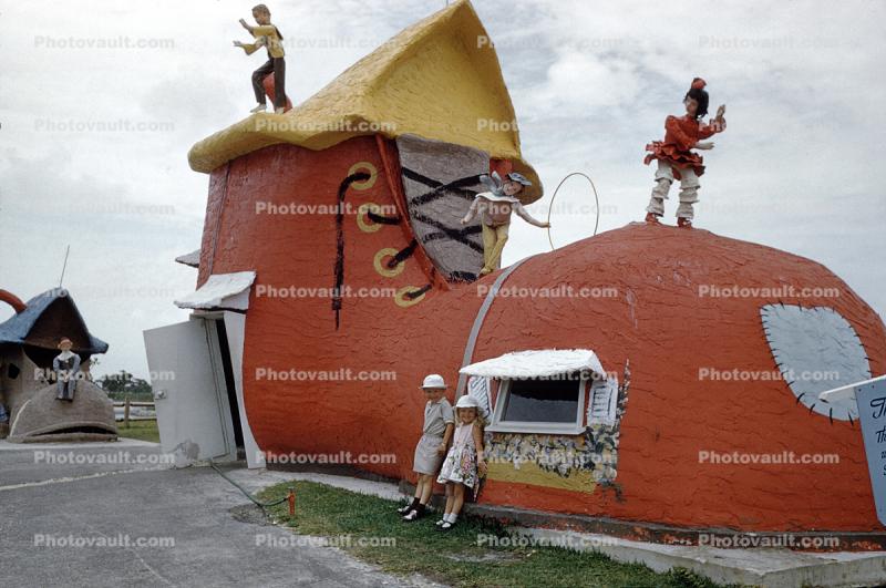 Girl and Boy at a big Shoe House, roof, patch, hats, bloomers, Shoe Lace, 1950s