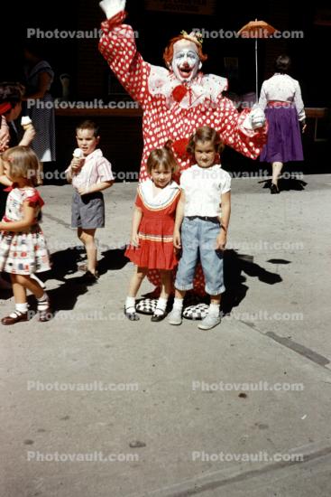 Clown, girls, tiny umbrella, 1950s