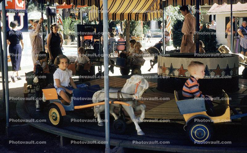 Vicki on a Kiddie Carousel, September 1955, 1950s