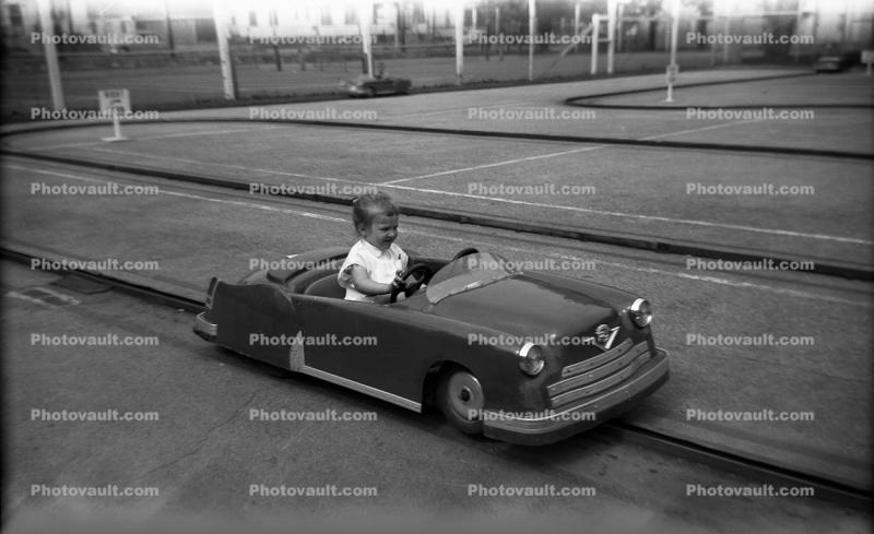 Little Girl Driving a Car, Cadillac, 1950s