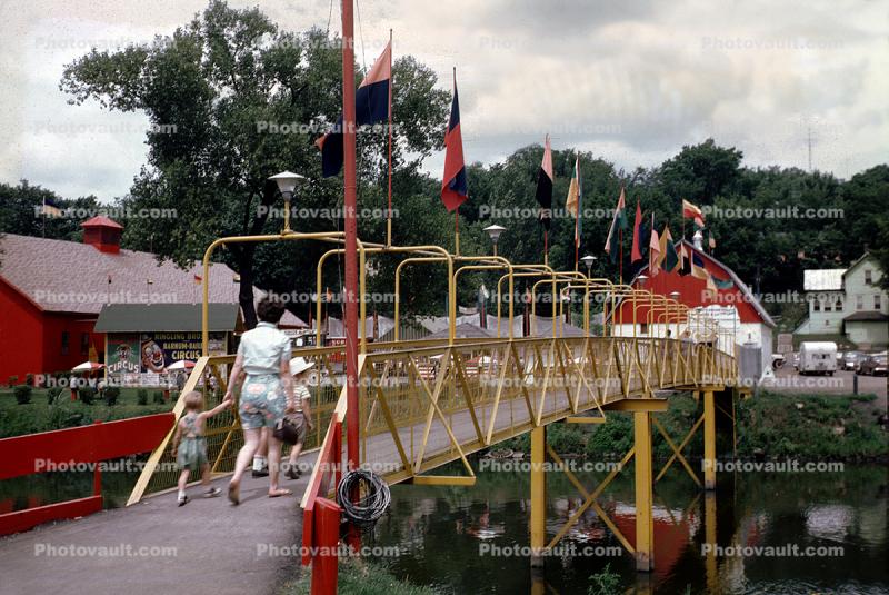 Bridge, River, buildings, flags, Circus Museum, Baraboo Wisconsin, July 1964, 1960s