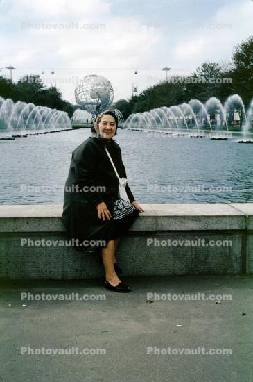 Woman Sitting, Fountain, Unisphere, PanAm Bag