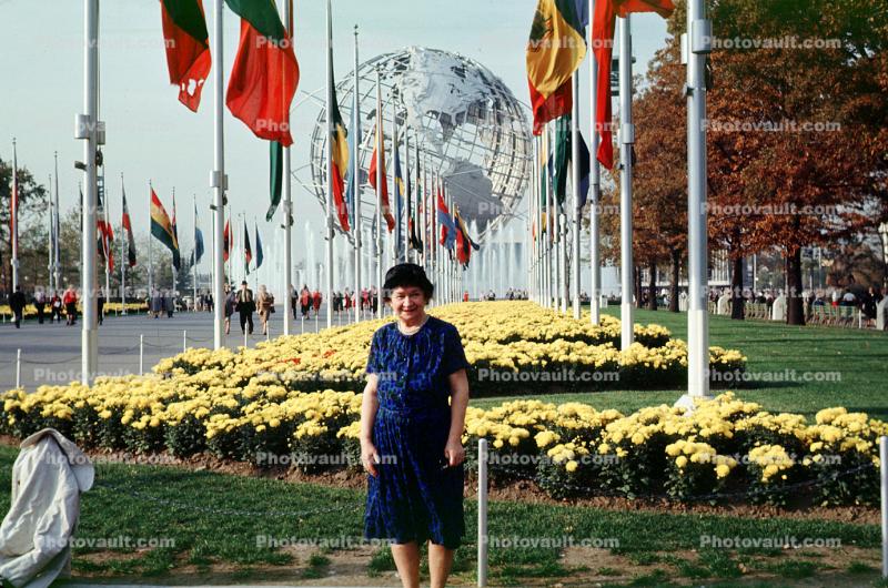 Unisphere, Woman, Yellow Flowers, Flags of All Nations
