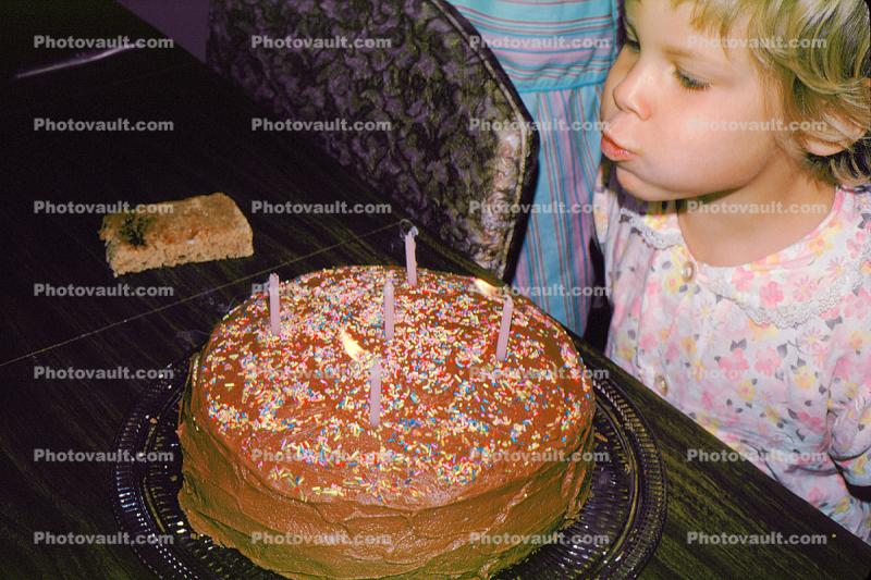Girl Blows out Candles on a Chocolate Cake, September 1971, 1970s