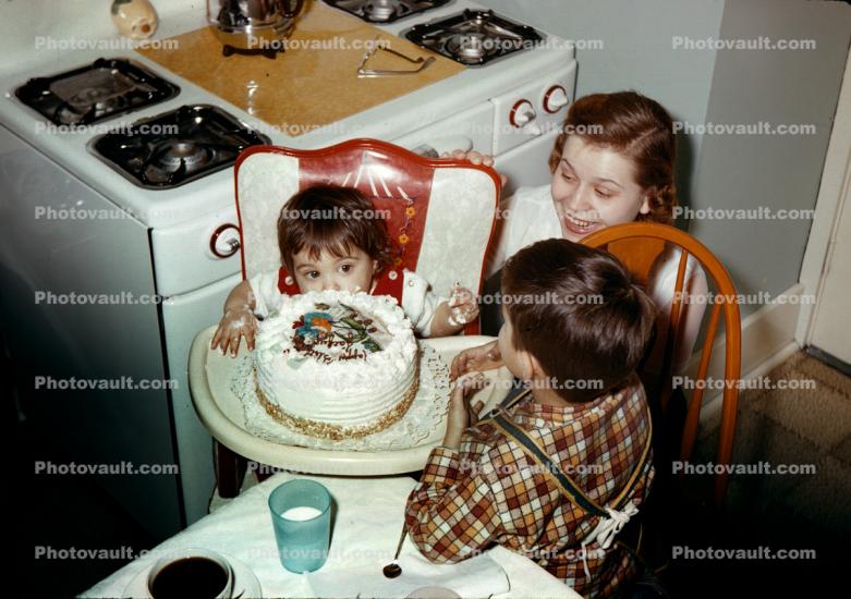 Woman and Boy with Baby Girl, Kitchen, Stove, 1950s