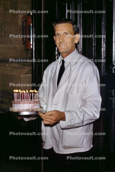 Baker with Birthday Cake, candles, 1950s
