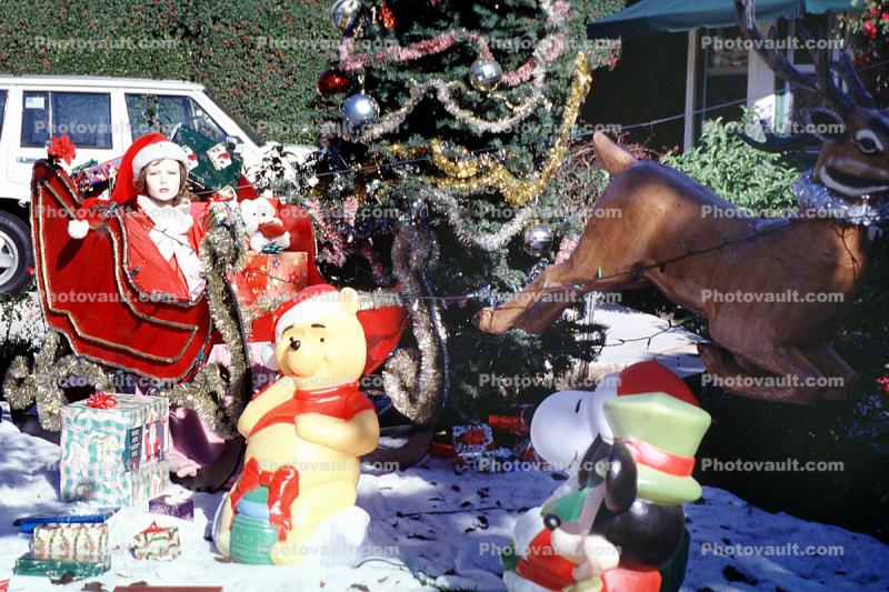 sled, MsSaint Santa Claus, bear, tree, presents, storybook scene Oxnard