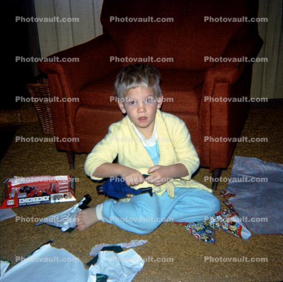 Boy Unwrapping Presents,  1950s