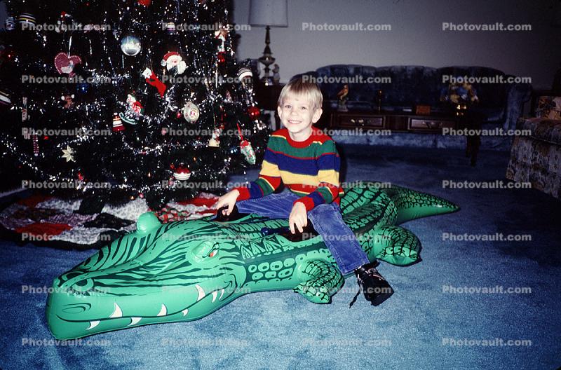 boy, tree, blow-up alligator, Christmas Morning, 1960s
