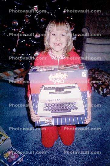 Girl, present, smiles, Petite 990 typewriter, Christmas Morning, 1960s