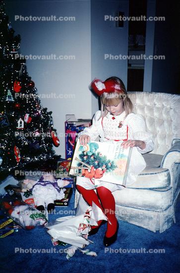 girl, chair, unwrapping presents, Christmas Morning, 1960s
