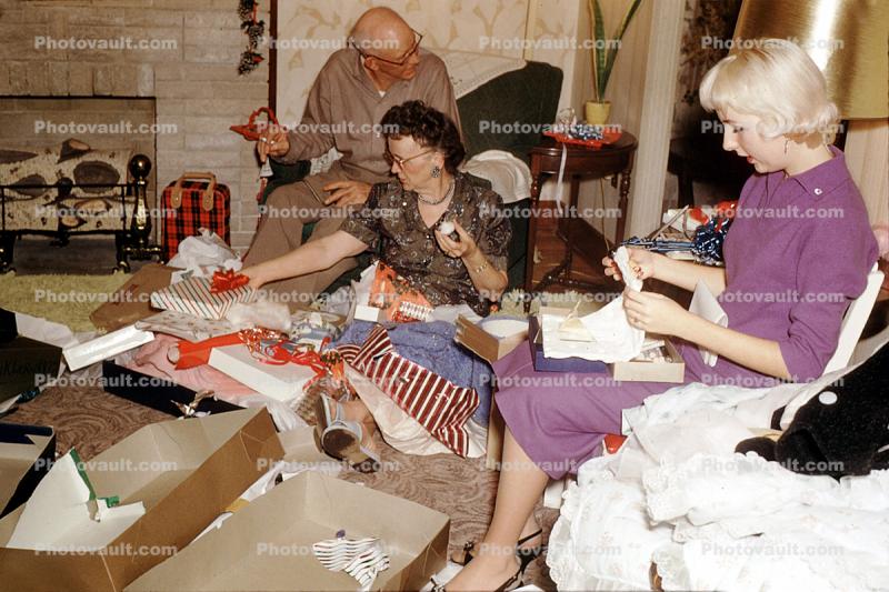 Women, man, opening Presents, Decorations, Ornaments, Platinum Blonde, empty box, Tulsa, 1950s
