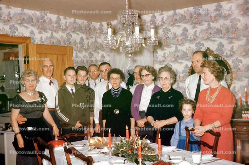 Grandma, dinning, dinner, smiles, chandelier, wallpaper, necklace, women, men, girl, 1950s
