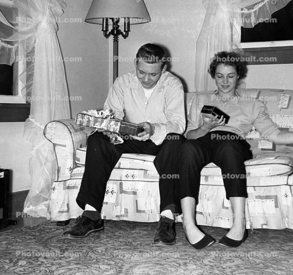 Presents, Couple, Sofa, smiles, 1950s
