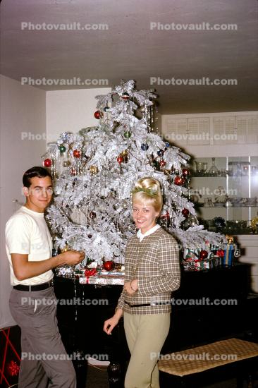 Woman, Man, decorating a Frosted Tree on a piano, Decorations, Ornaments, 1960s
