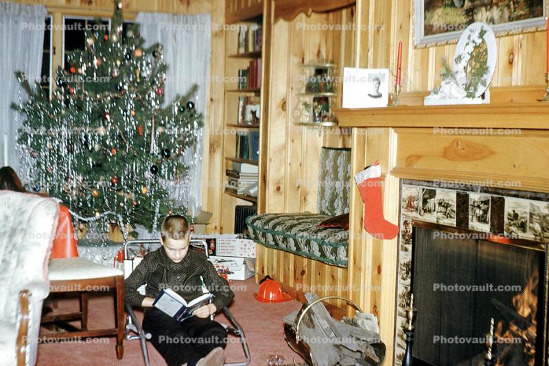 boy reading, fireplace, sitting, Tree, Presents, Gifts, Decorations, Ornaments, 1950s