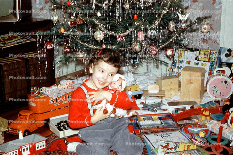 opening presents, girl with doll, Allied Van Line toy truck, toy airplane, hugs, hugging, tinsel, Tree, Presents, Gifts, Decorations, Ornaments, 1950s