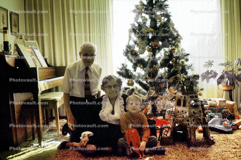Christmas morning, grandfather, grandmother, grandson, piano, woman, man, boy, Tree, Presents, Gifts, Decorations, Ornaments, 1950s