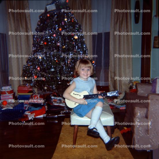 Smiling Girl and her new Guitar, tree, presents, gift, knee socks, December 1967, 1960s