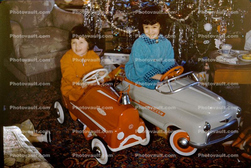 Girls in their new Pedal Cars, toys, 1950s
