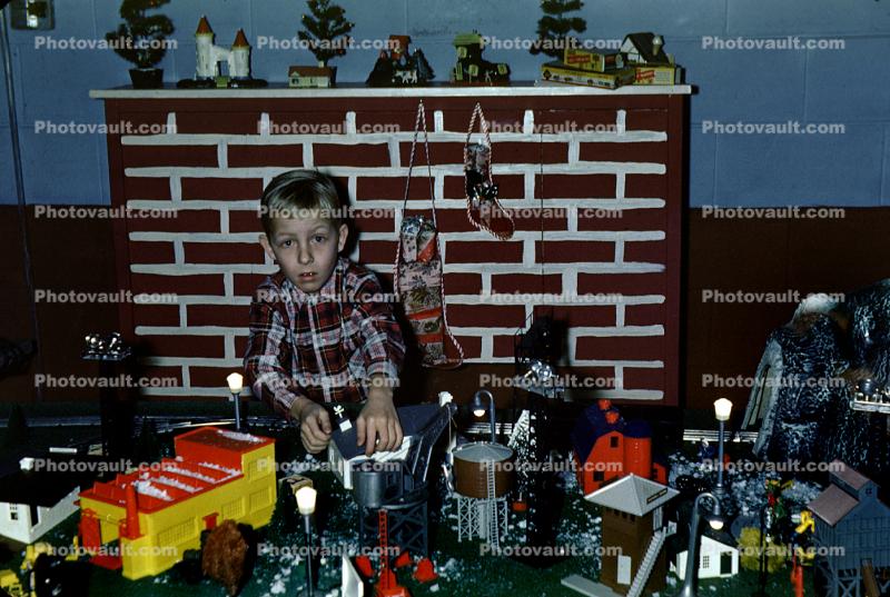 Boy with Many Presents, toys, fireplace, 1950s